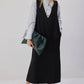Abito pinafore nero con scollo a V