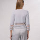 Giacca corta in maglia lurex con trasparenze
