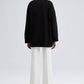Maglione nero oversize con bottoni asimmetrici