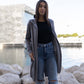 Gilet lungo con cappuccio in maglia morbida