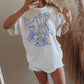 T-shirt oversize grafica “Le Petit Déjeuner” in cotone