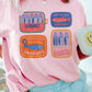 T-shirt oversize con stampa collage di sardine
