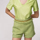 Shorts effetto tweed con catena