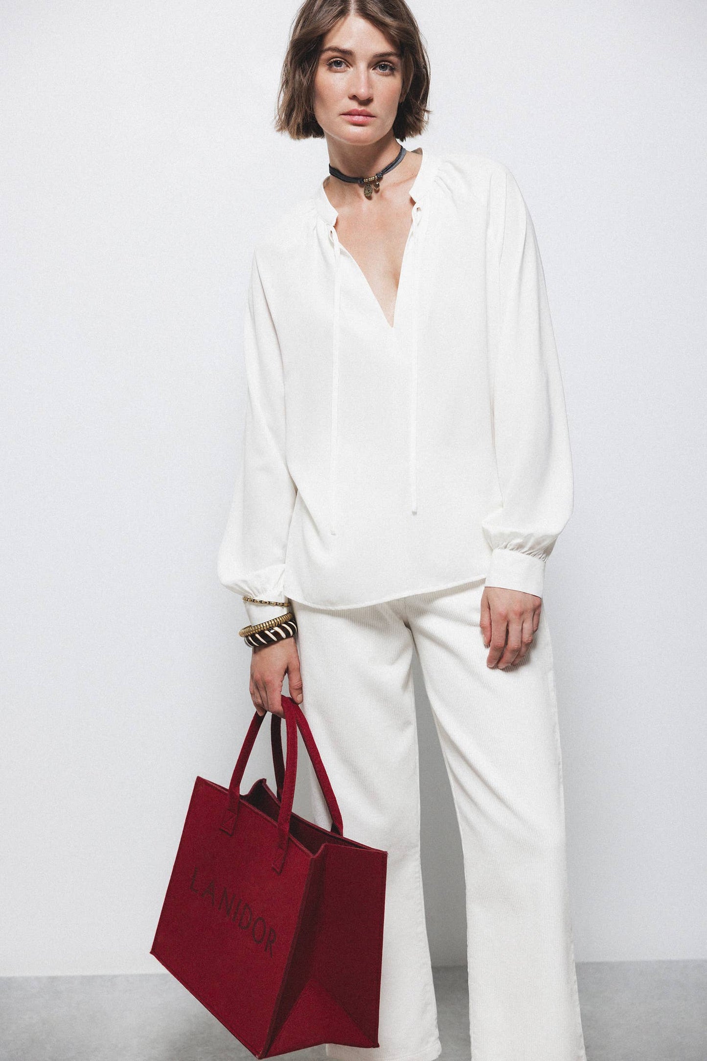 Blusa con coulisse e scollo arricciato