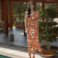 Abito midi terracotta con stampa floreale
