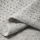 Sciarpa triangolare in maglia pointelle