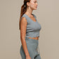 Top crop in maglia a costine con bordo ondulato