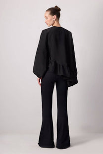 Blusa nera con balza asimmetrica