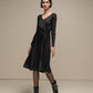 Abito midi in maglia lurex con gonna plissé e cintura