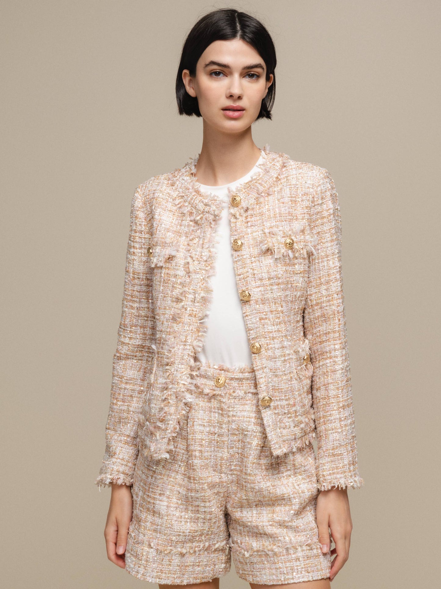 Blazer bouclé corto con bottoni gioiello