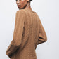 Maglione in lana a trecce con scollo a V