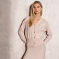 Set in maglia fine con cardigan e gonna ricamata