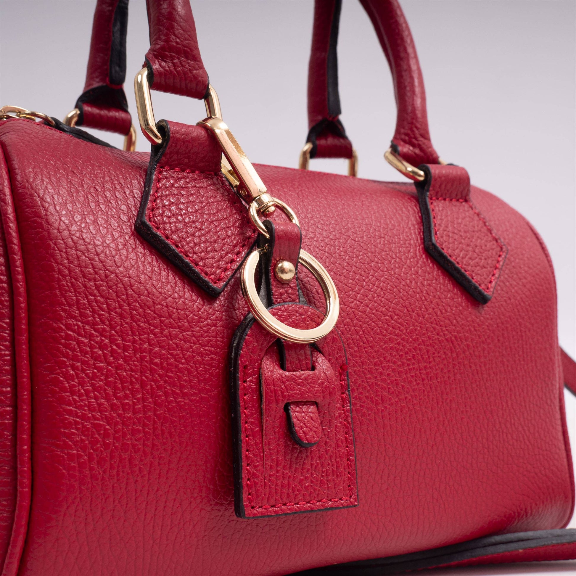 Borsa bauletto in pelle martellata con tracolla