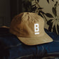 Cappellino in tela cerata con logo ricamato