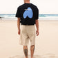 T-shirt oversize nera con stampa spray