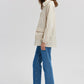 Impermeabile beige con tasche applicate