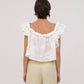 Top bianco Lux con volant e ricami