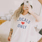 T-shirt oversize grafica “Locals Only” in cotone