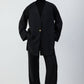 Giacca nera oversize con scollo a V e bottone