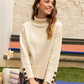 Maglione dolcevita in maglia Matis con polsini a bottoni