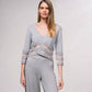 Giacca corta in maglia lurex con trasparenze