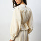 Set coordinato crema con blusa peplo e gonna maxi