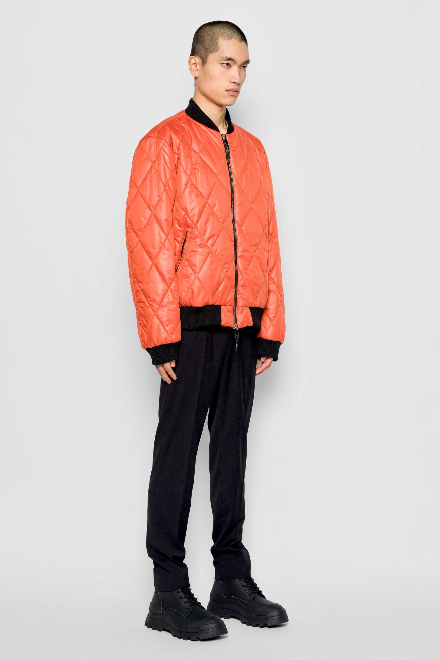 Bomber trapuntato a rombi arancione con zip