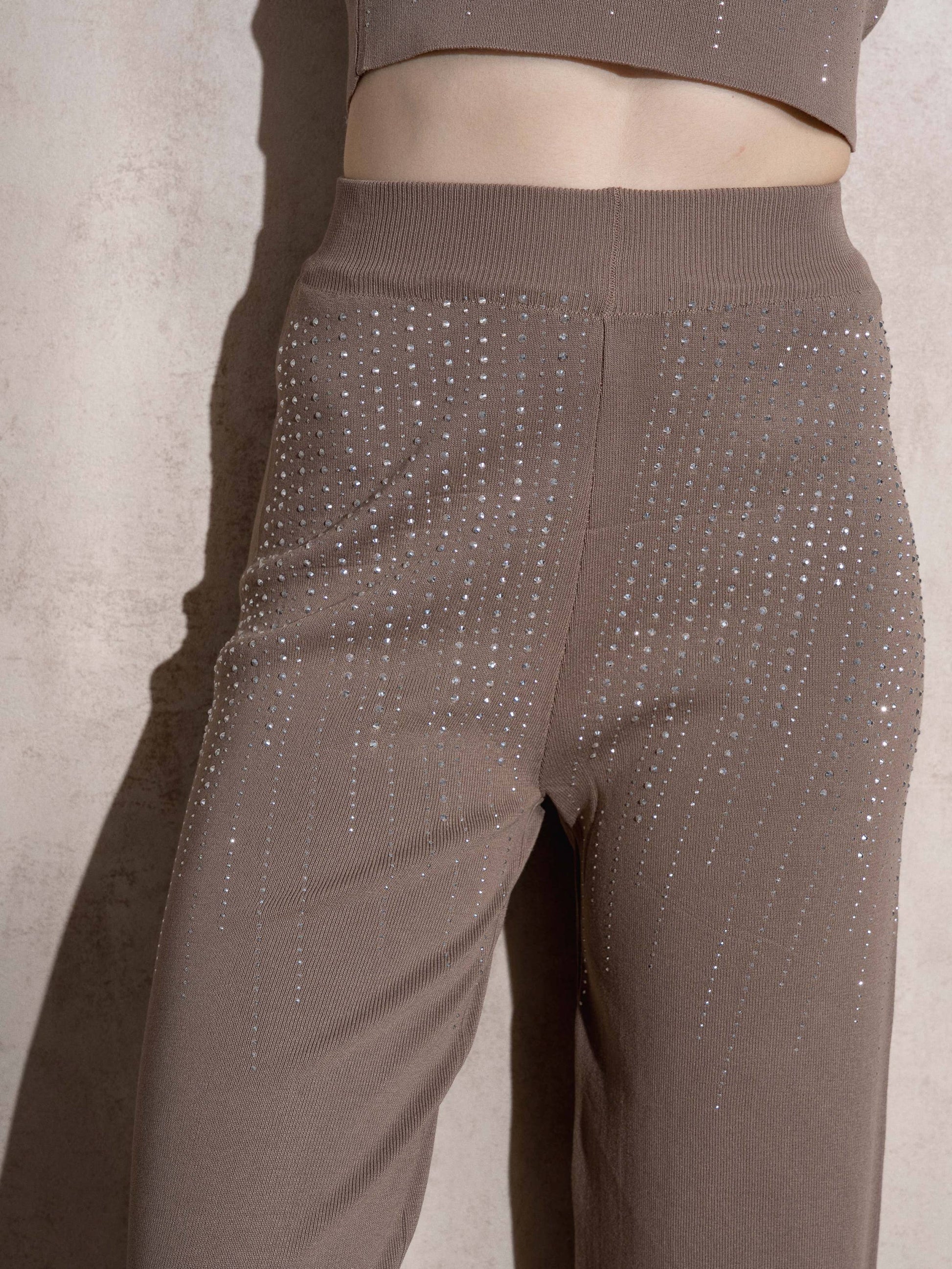 Pantaloni a vita alta in maglia con glitter