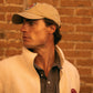 Cappellino in cotone biologico color sabbia con patch ricamata