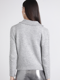 Polo in maglia con maniche a treccia
