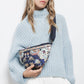 Pochette in velluto con perline e motivo floreale