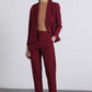 Pantaloni cropped bordeaux con bottoni dorati