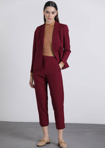 Pantaloni cropped bordeaux con bottoni dorati