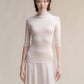 Dolcevita a coste in lana merino extrafine con manica 3/4