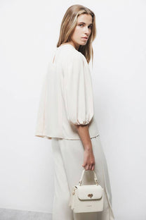 Blusa con pieghe e maniche a palloncino