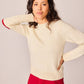 Maglione bianco in maglia con toppe a cuore e bottoni sul retro