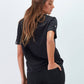 T-shirt con applicazione G in strass