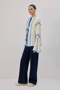 Cardigan in maglia con laccetti e profili a contrasto