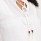 Blusa Tichka in cotone con laccetti e maniche a volant