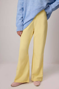 Pantaloni a zampa a vita alta giallo pastello con zip laterale