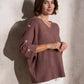 Maglia ampia in maglia con bottoni sulle maniche