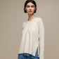 Maglione in maglia con scollo a V e micro paillettes