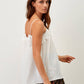 Top bianco in pizzo con spalline sottili