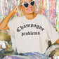T-shirt oversize grafica “Champagne Problems”