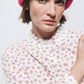 Blusa floreale con volant e bottoni