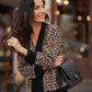 Cardigan animalier in maglia con bordi neri