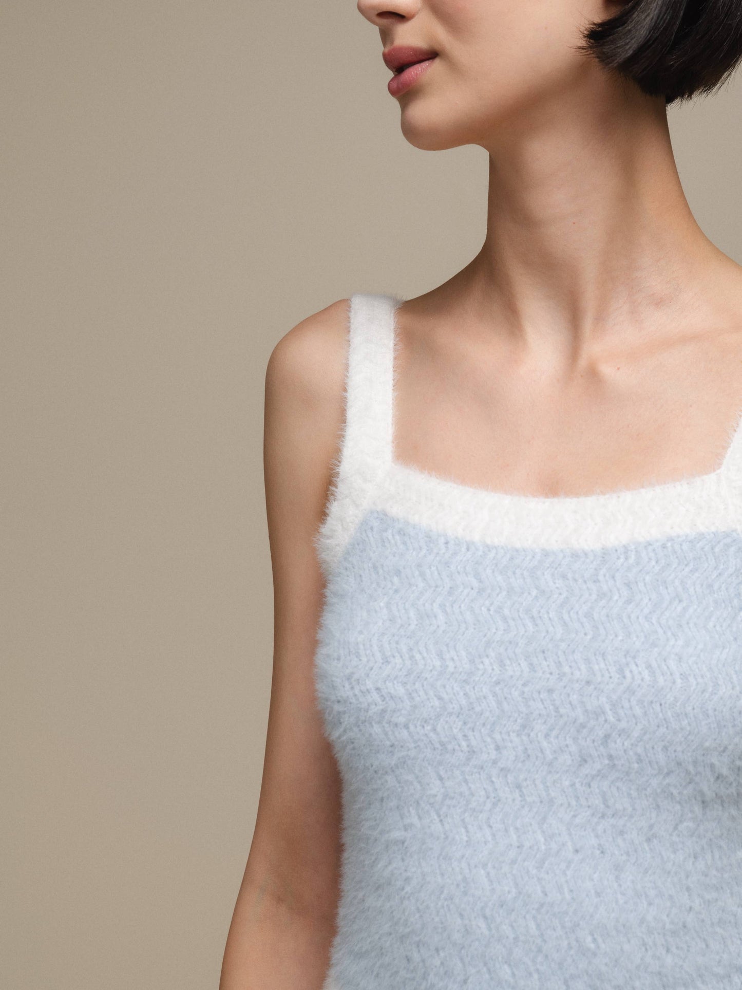 Top in maglia effetto fluffy bicolore