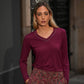 Maglia donna a manica lunga con scollo a V e borchie