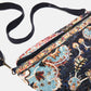 Pochette in velluto con perline e motivo floreale