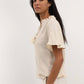 Blusa Tichka in cotone con laccetti e maniche a volant